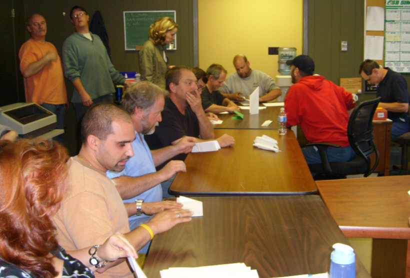 Lean game participants in a manufacturing setting.